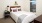 a bed with a white comforter