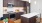 a kitchen with a table and chairs