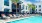 a pool with chairs around it