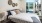 a bedroom with a large window