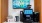 a tv and a computer monitor on a shelf