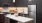 a kitchen with a table and a refrigerator